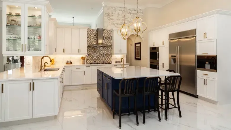 Modern Kitchen Design Trends in Burlington with elegant white cabinets and navy island