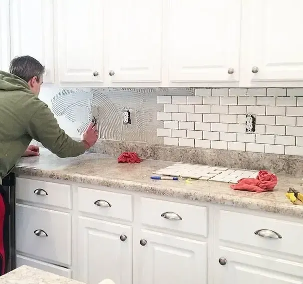 backsplash tile repair in Burlington kitchen with neat tile lines and clean finish