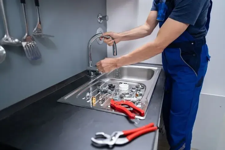 sink plumbing repair in Burlington with modern kitchen design and improved drain system